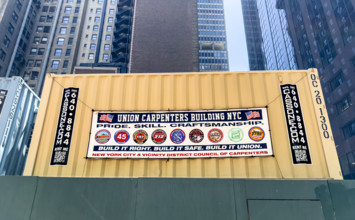 Union Carpenters Building NYC banner hanging on building exterior wall, Manhattan, New York City