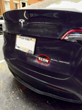Anti-Elon Musk bumper sticker on Tesla electric car, New York City