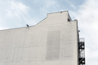 Industrial building exterior wall with no windows, 431 South Fairfax Avenue, Los Angeles