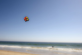 Kite surfer catching a wave