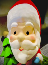 Plastic Santa Claus Christmas decoration on store shelf