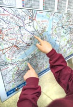 Fingers pointing at outdoor city map, Boston