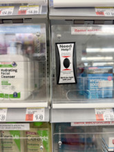 Customer assistance button on merchandise display case, New York City