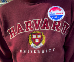 I voted sticker on a Harvard Sweatshirt