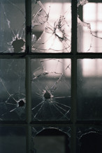 Broken window panes in abandoned building
