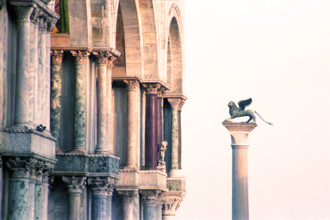 Column of San Marco is depicted with its winged lion, St. Mark's Square, Venice, Italy