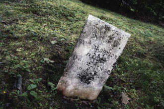 Weathered upright gravestone