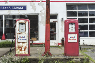 Abandoned old-fashioned Mobil gas station and auto repair garage