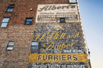 Old advertisements hand-painted on exterior wall of building, Buffalo, New York, USA
