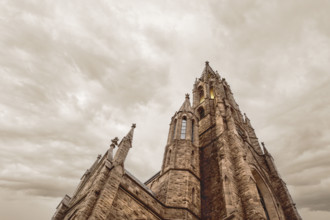 Low angle view of St. Louis Roman Catholic Church, low angle view against dramatic cloudy sky,