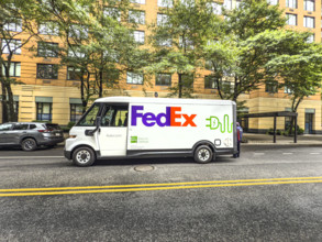 Federal Express electric delivery truck and street scene, Manhattan, New York City, New York, USA