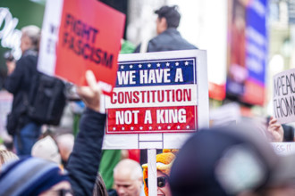 Demonstrators participating in "No Kings" Protest March, Times Square, Manhattan, New York City,