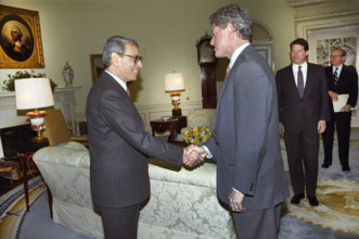 U.S. President Bill Clinton shaking hands with United Nations Secretary-General Boutros