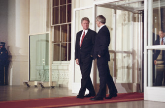 U.S. President Bill Clinton escorting British Prime Minister John Major to awaiting motorcade,