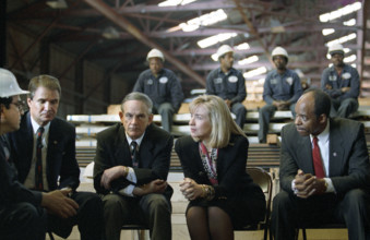 U.S. First Lady Hilary Clinton participating in health care costs discussion with Glazer Steel