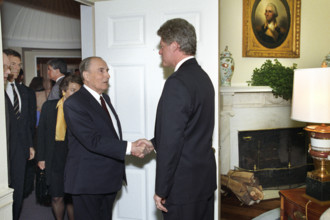 U.S. President Bill Clinton greeting French President François Mitterrand of France as he arrives