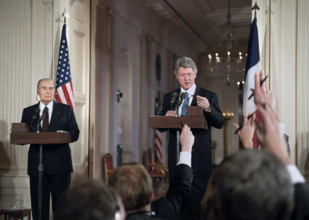 U.S. President Bill Clinton and French President François Mitterrand giving press statements in the