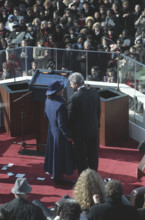 Rear view of U.S. President Bill Clinton with U.S. First Lady Hillary Clinton after being sworn in,