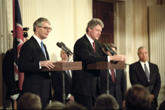 U.S. President Bill Clinton and British Prime Minister John Major delivering press statements, East