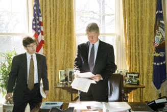 U.S. President Bill Clinton meeting with White House Communications Director George Stephanopoulos