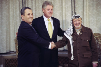 U.S. President Bill Clinton with Prime Minister Ehud Barak of Israel and Chairman Yasser Arafat of