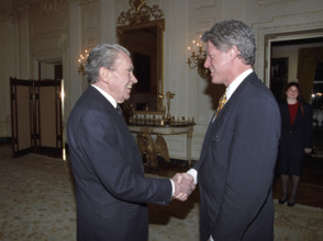 U.S. President Bill Clinton shaking hands with former U.S. President Richard Nixon in private
