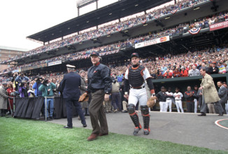 U.S. President Bill Clinton attending opening day baseball game between the Baltimore Orioles and