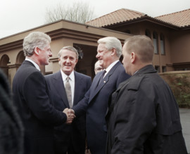 U.S. President Bill Clinton shaking hands with Russian President Boris Yeltsin as Canadian Prime