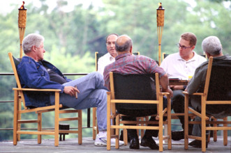 U.S. President Bill Clinton meeting with foreign policy staff at Camp David during the