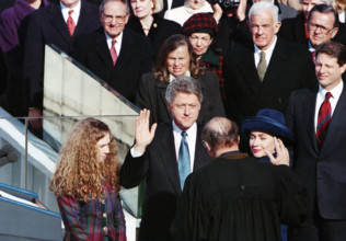 U.S. President-Elect Bill Clinton being sworn-in by Chief Justice of the U.S. William Rehnquist, as