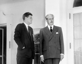 U.S. President John F. Kennedy and British Prime Minister Harold MacMillan standing in the West