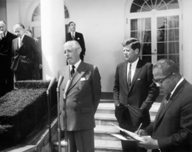 British Prime Minister of Great Britain Harold Macmillan prepares to speak as U.S. President John F