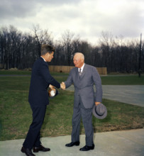 U.S. President John F. Kennedy shaking hands with former U.S. President Dwight D. Eisenhower, Camp
