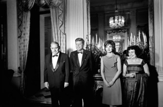 U.S. President John F. Kennedy and U.S. First Lady Jacqueline Kennedy attending dinner hosted by