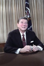 U.S. President Ronald Reagan's address to the nation on the economy (holding dollar) from Oval