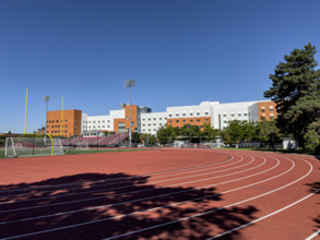 Running track and athletics field with New Vassar undergraduate dormitory in background,