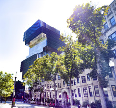 Row of commercial and residential buildings with Boston University's Duan Family Center for