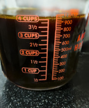 4 cups of beef stock in glass measuring cup