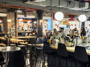 Group of people eating at casual restaurant, Dickson's Farmstand Meats, Chelsea Market, Ninth
