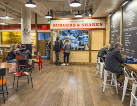 Two people ordering food at take-out counter, Creamline, Chelsea Market, Ninth Avenue, Chelsea,