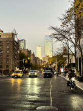 Street scene at dusk, Ninth Avenue at 16th Street, looking north to Hudson Yards, Manhattan, New