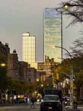 Street scene at dusk, Ninth Avenue at 16th Street, looking north to Hudson Yards, Manhattan, New