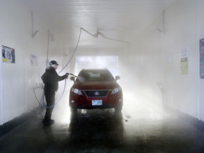 Man washing car at self-service car wash
