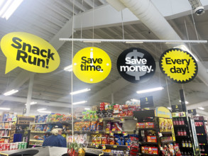 Man shopping for snacks in Dollar General supermarket