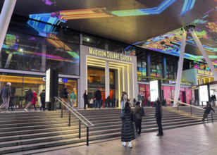 Crowd outside Madison Square Garden entrance at night, Seventh Avenue, Manhattan, New York City,