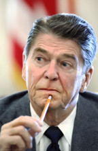 Head and shoulders portrait of U.S. President Ronald Reagan during meeting with members of congress