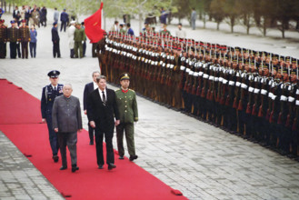 U.S. President Ronald Reagan reviewing Chinese troops during arrival ceremony at Great Hall of The