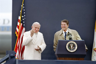 U.S. President Ronald Reagan and Pope John Paul II standing at podium at Fairbanks Airport, Alaska,