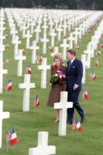 U.S. President Ronald Reagan and U.S. First Lady Nancy Reagan walking through Omaha Beach Cemetery