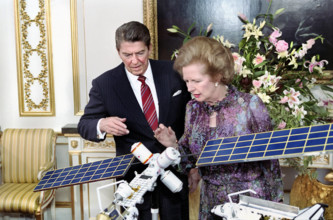 U.S. President Ronald Reagan and British Prime Minister Margaret Thatcher viewing model of manned